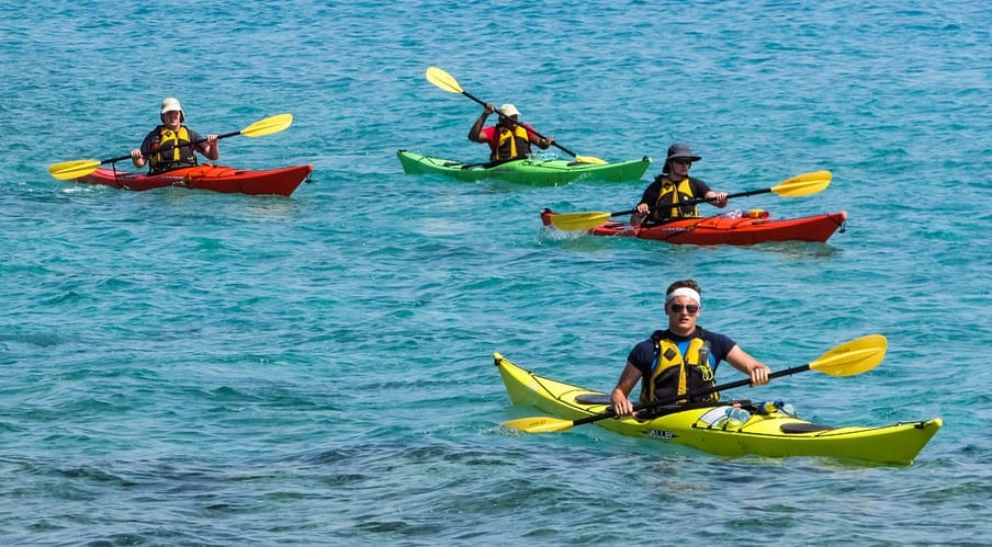 a group of people kayakingc